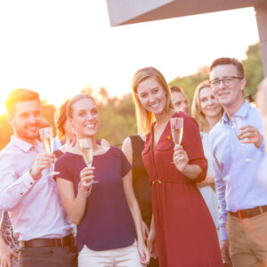 A group of colleagues enjoys champagne during a business retreat in Asheville 
