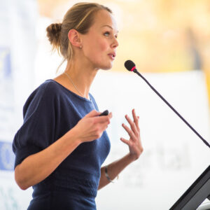 A speaker gives a presentation at a corporate event 