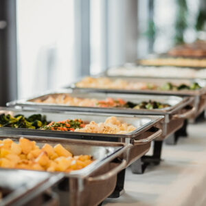 A buffet line at a wedding featuring locally sourced ingredients 