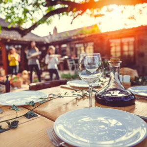 A table setting at an outdoor catering venue at sunset