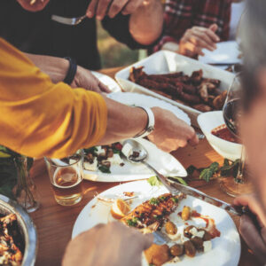 Family-style dining at an outdoor event venue 