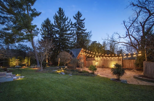 Outdoor event space decorated with lights